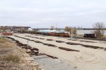 Eastbound to southbound coal loads roll along the Mississippi as the old Northwestern Pacific SD9 rests